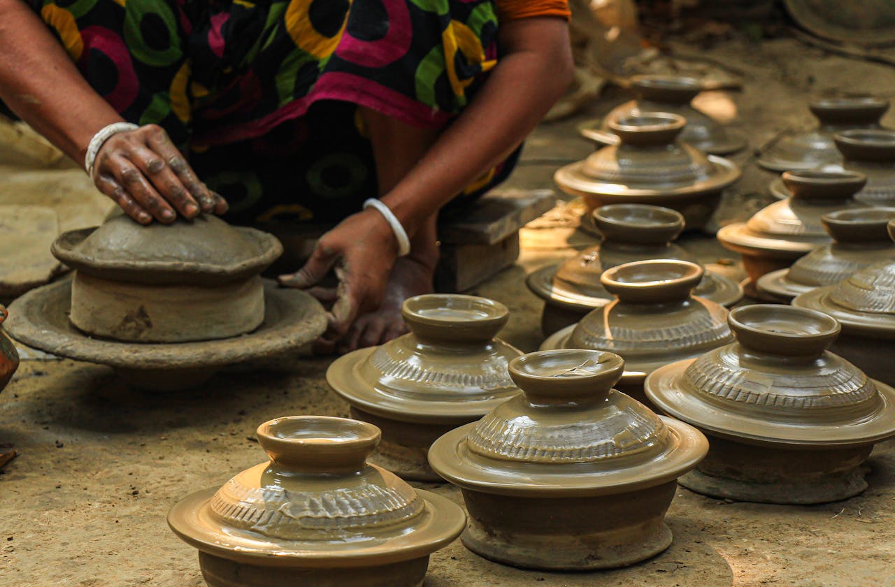 services-01 artisan-crafting-traditional-clay-pots-outdoors-35048983